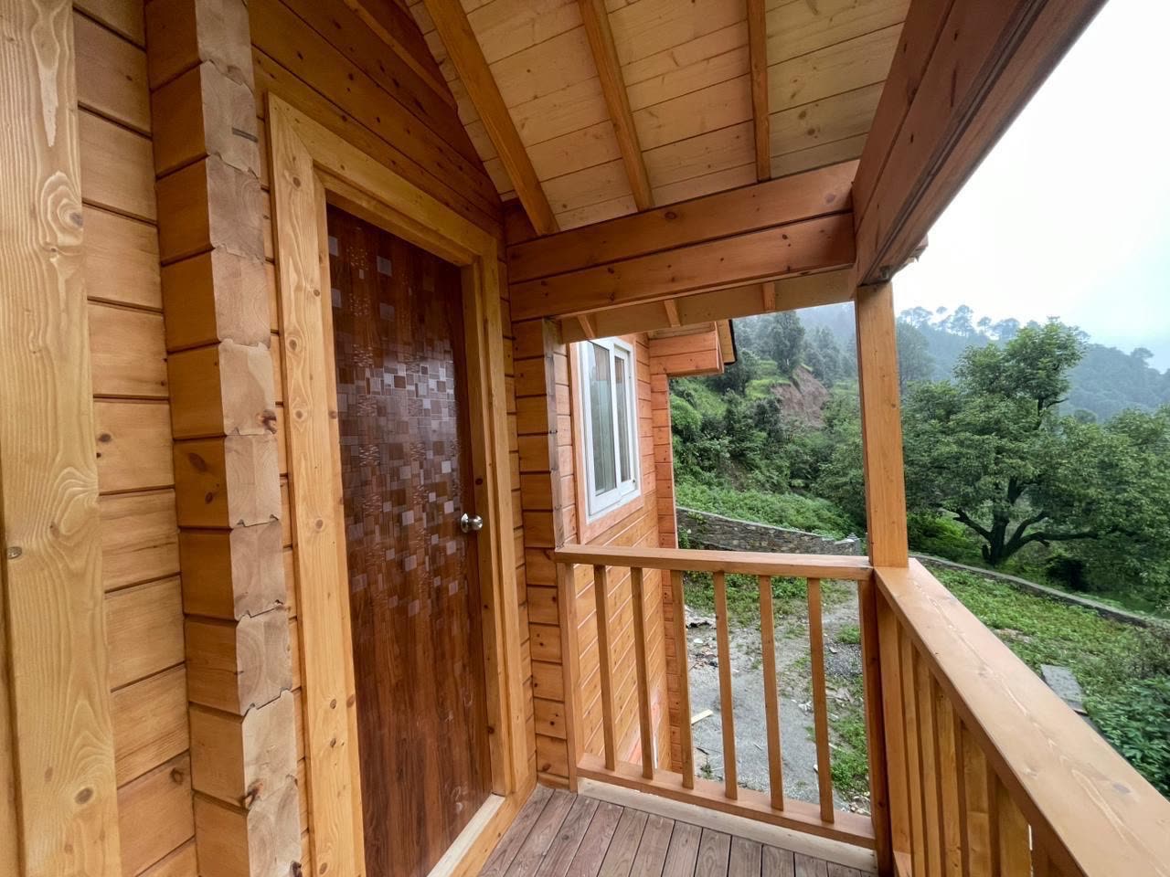 Private balcony of the upstairs bedroom with views of pine forest