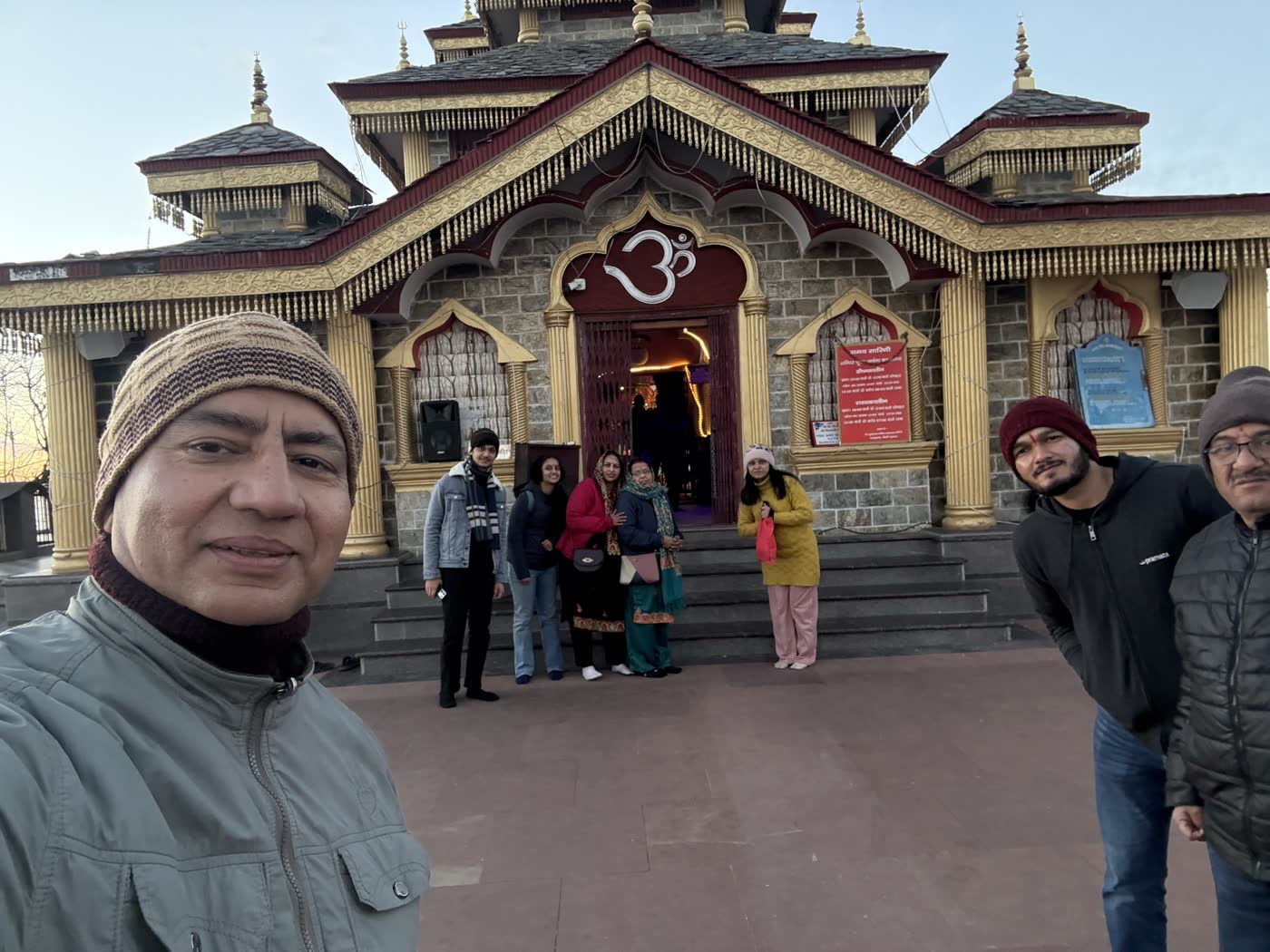 The grand Surkanda Devi temple with its golden carved roof and stone facade